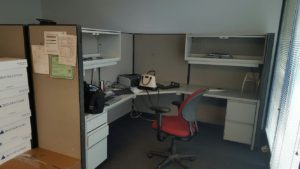 office cubicle and electronics ready for removal