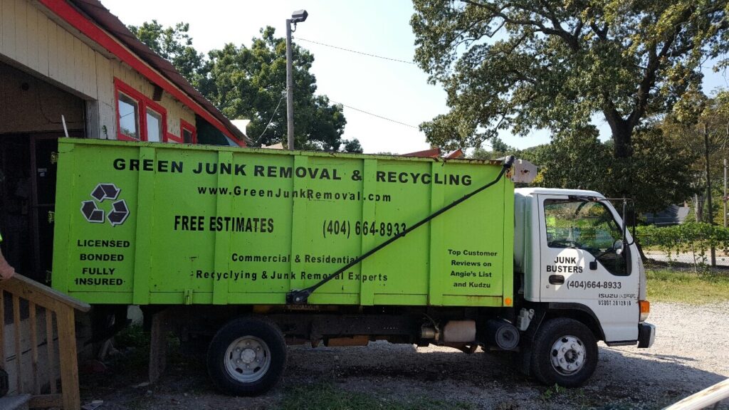 Green Junk Removal truck loads up appliances to recycle